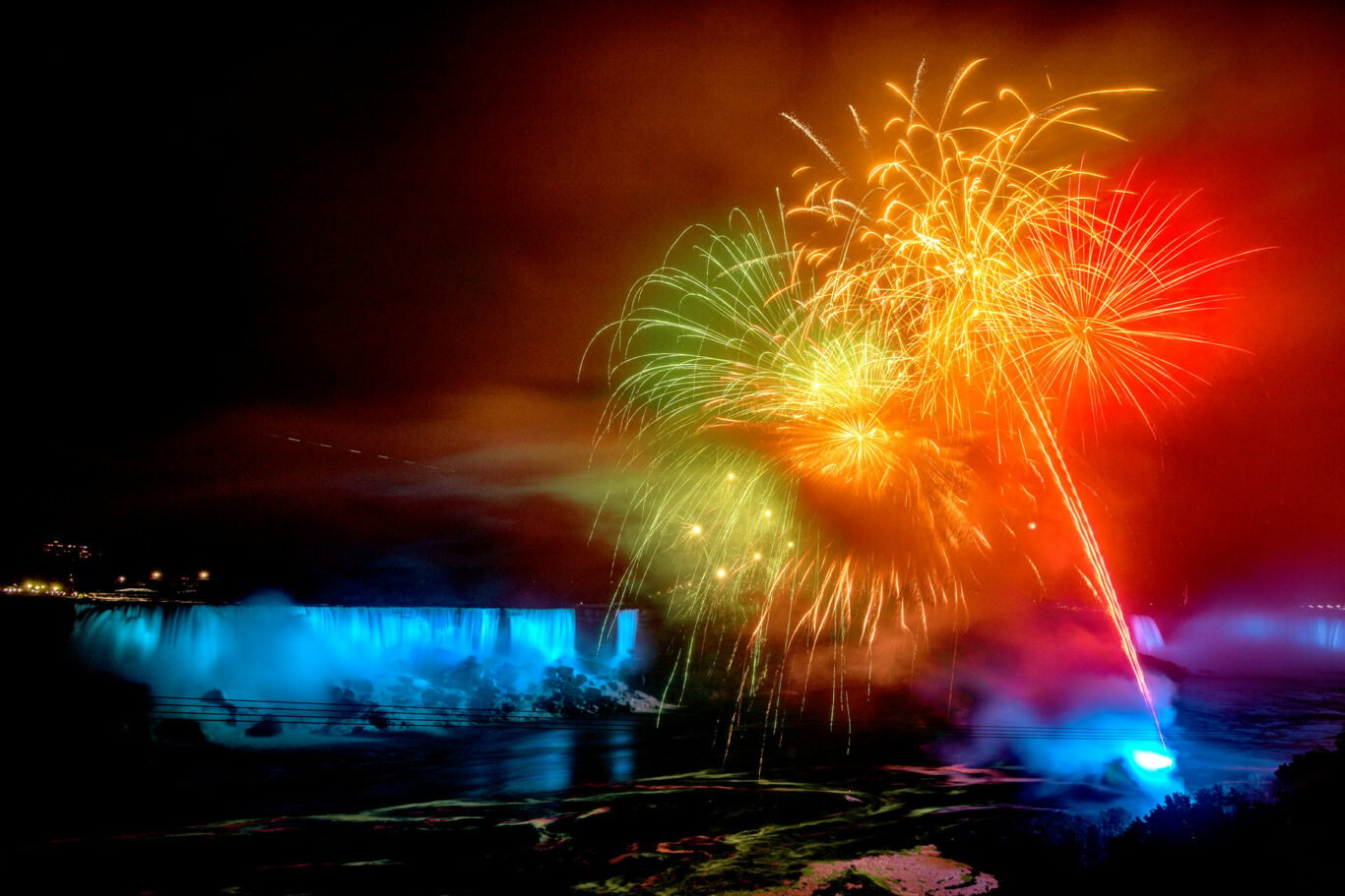 Colorful fireworks display over Niagara Falls on a late summer night.