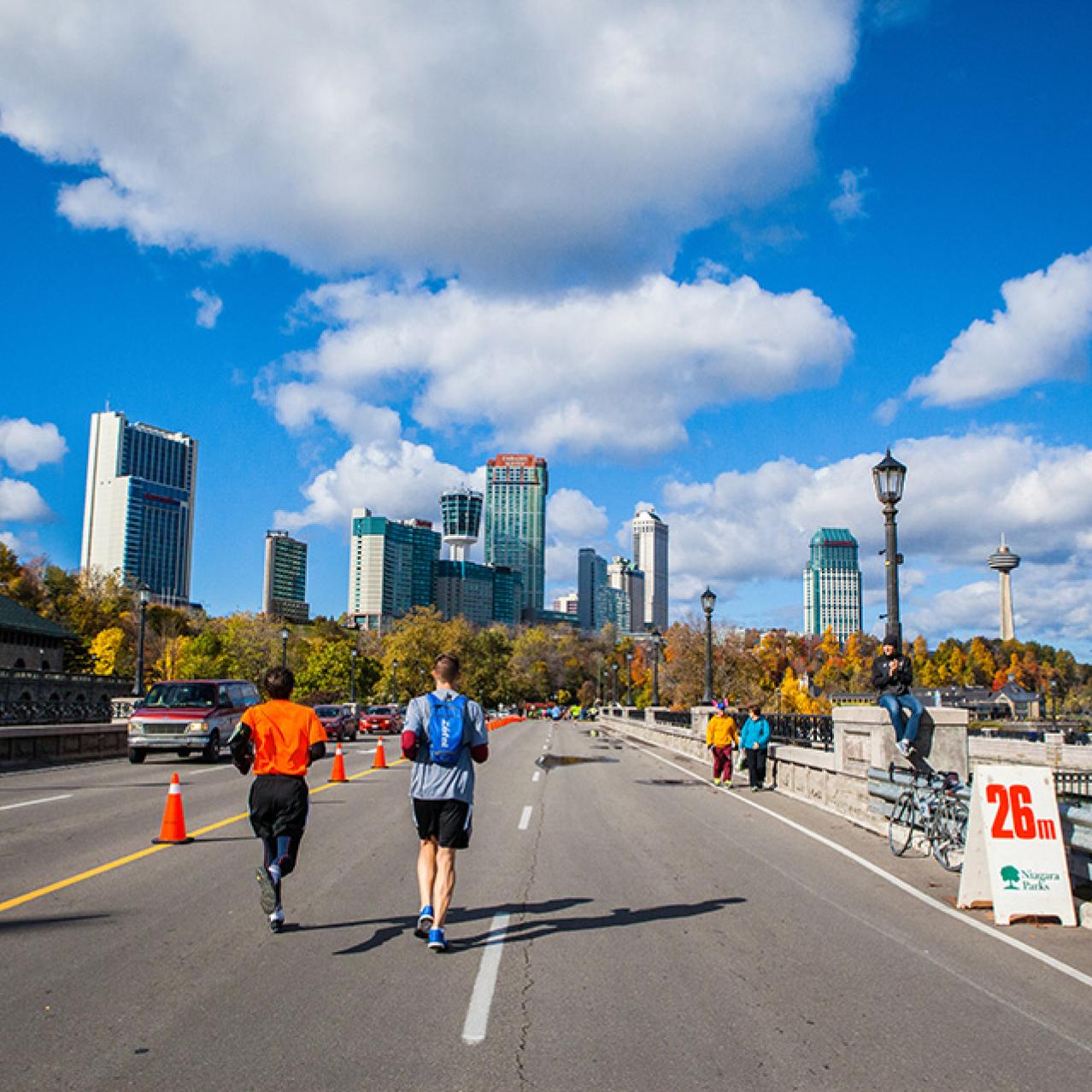 2 runners along the parkway